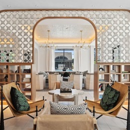 a clubroom with a table and chairs