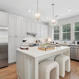 a kitchen with white cabinets