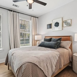 a bedroom with a bed and two nightstands