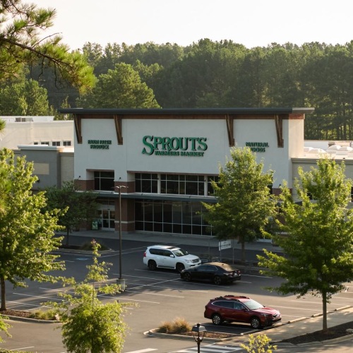 a building with cars parked in front