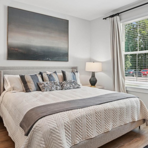 a bedroom with a large window