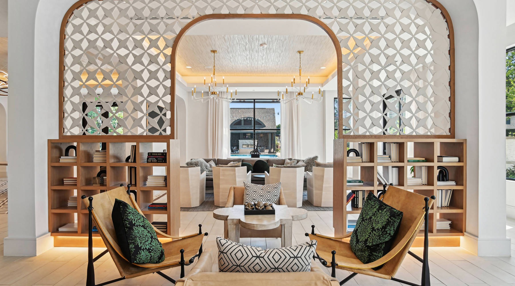 a lounge area with bookcases